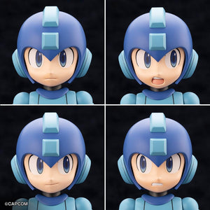 Four interchangeable face plates included in the Kotobukiya Mega Man 11 Grande Scale kit: neutral, shouting, smiling, and clenched teeth.