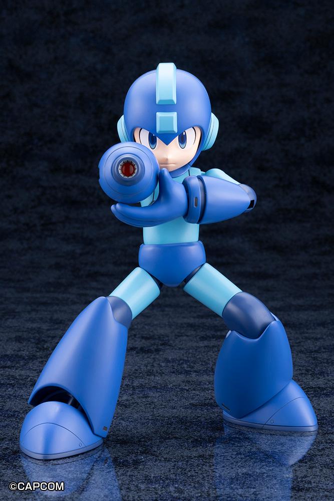 Frontal view of Mega Man aiming the Mega Buster arm cannon directly forward while steadying it with his other hand.