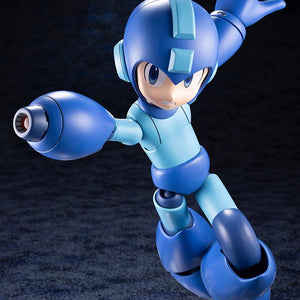 Mid-flight action jump pose of Mega Man firing the Mega Buster cannon forward with his left arm extended back.