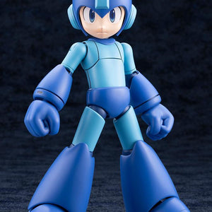 Front standing view of the assembled Kotobukiya Mega Man 11 Grande Scale model kit with neutral expression on a dark reflective surface.