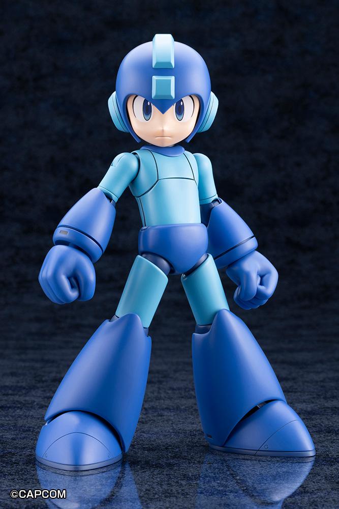Front standing view of the assembled Kotobukiya Mega Man 11 Grande Scale model kit with neutral expression on a dark reflective surface.