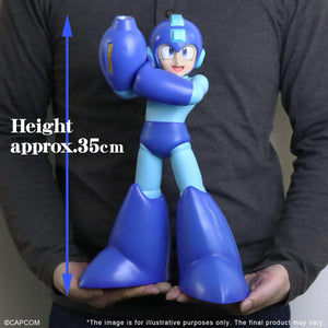 Real-world scale shot of a person holding the massive Mega Man Gigantic Series figure to demonstrate its impressive height of approximately 35 centimeters.