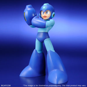 Full-body three-quarter studio shot of the premium Mega Man Gigantic Series figure standing against a vivid blue gradient background.