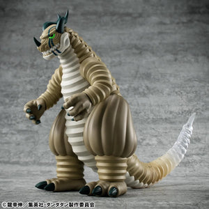 Angled front view of the Megahouse DAN DA DAN Transparent Kaiju Sofubi Figure, showcasing its large size and powerful stance.