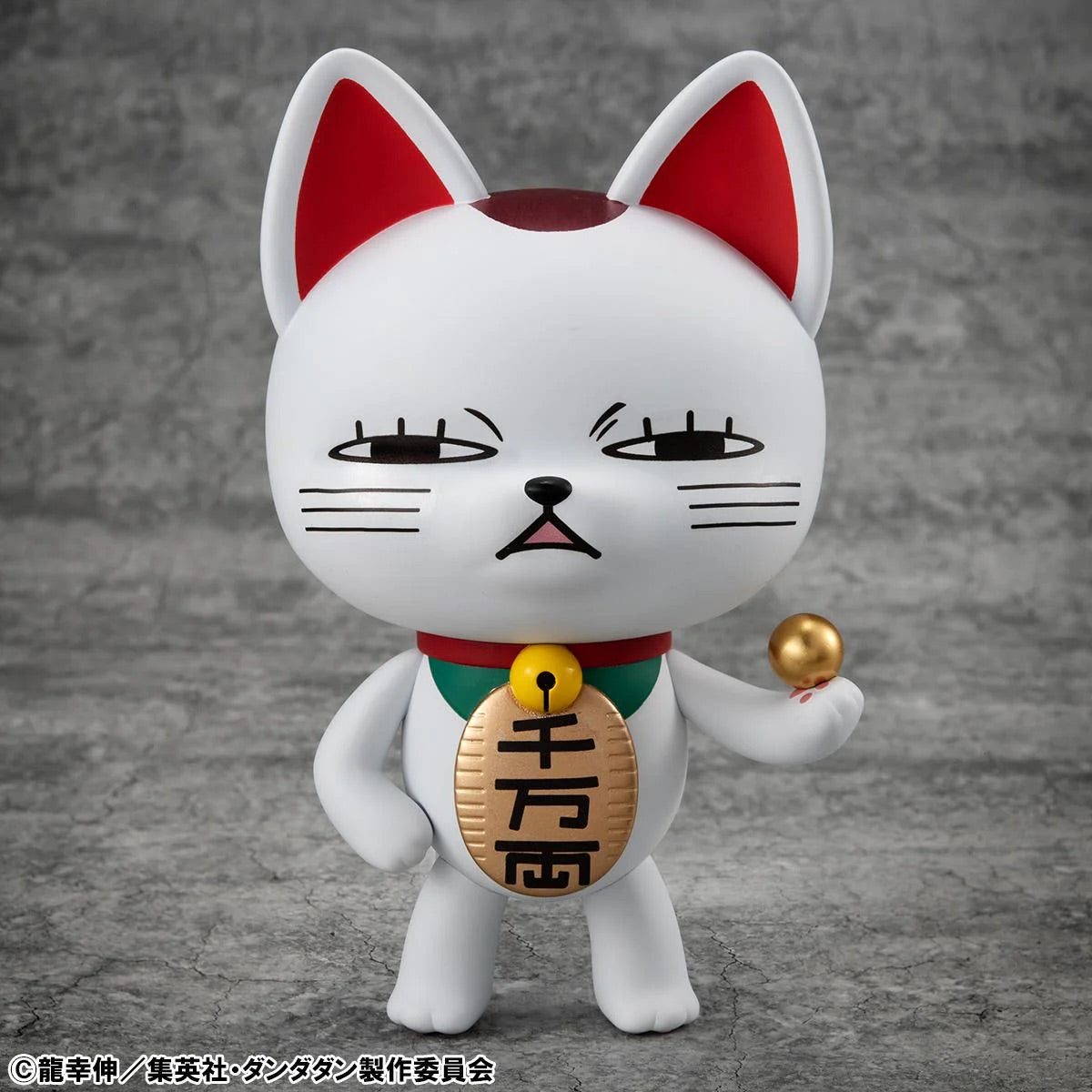 Full frontal view of the Megahouse Turbo Granny Occultic Sofubi Fortune Cat Ver. 2 figure, featuring a skeptical expression and holding a golden ball.