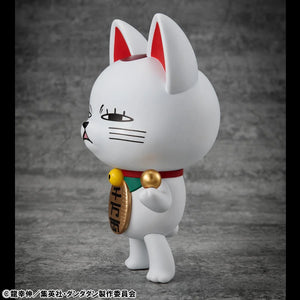 Side profile of the Turbo Granny Fortune Cat figure, showing its mischievous side-eye expression and its collar with a bell.