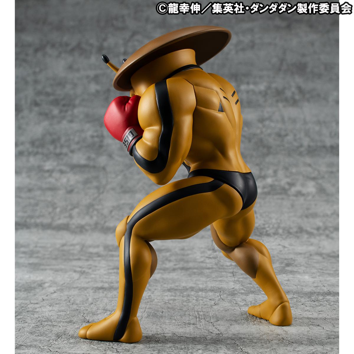Back-left angle view of the MegaHouse Dover Demon designer art toy, detailing the black suit elements and stripes running down its back and legs.