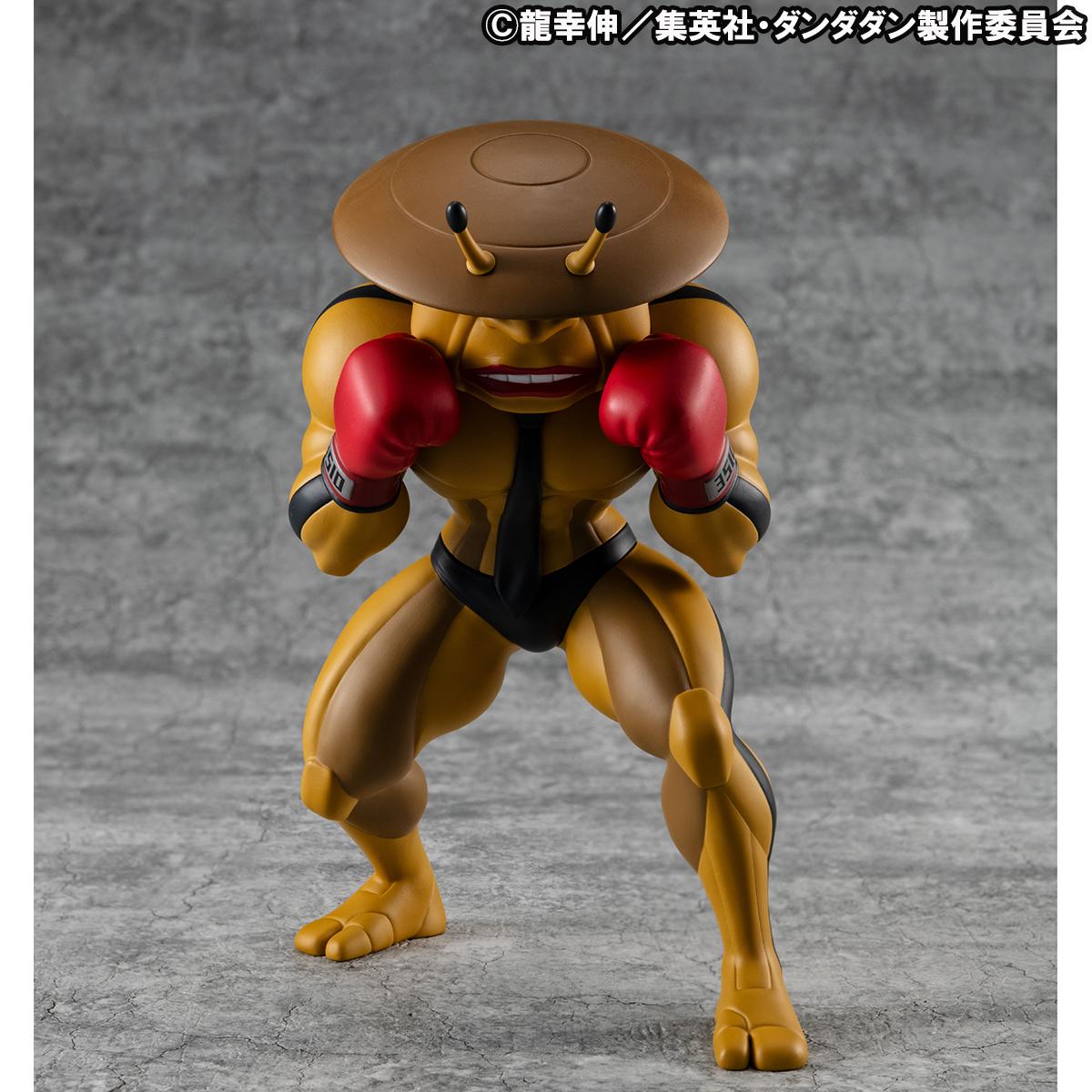 Front view of the MegaHouse Dandadan Occultic Sofubi Collection Dover Demon Vinyl Figure, featuring its signature yellow body, saucer-shaped head, and red boxing gloves.