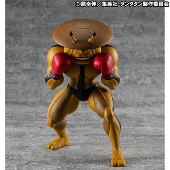 Front view of the MegaHouse Dandadan Occultic Sofubi Collection Dover Demon Vinyl Figure, featuring its signature yellow body, saucer-shaped head, and red boxing gloves.