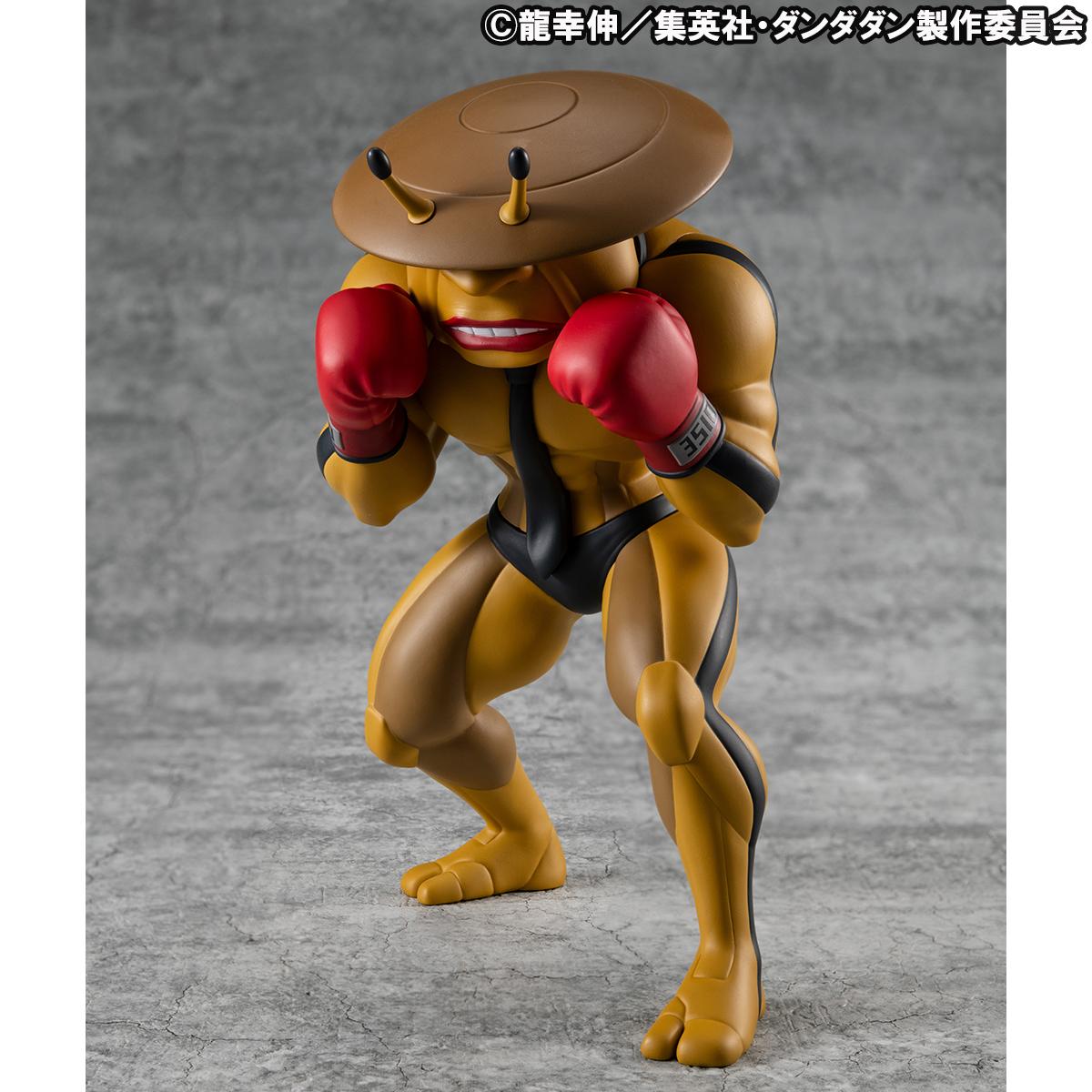 Front-left angle of the Dover Demon vinyl figure from Dandadan, showcasing its muscular alien physique, black racing stripes, and boxing stance.