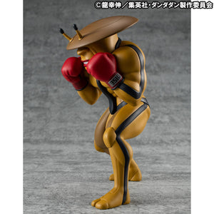 Left profile view of the non-articulated Dandadan Dover Demon Sofubi figure, highlighting the antennae on its head and its toothy grin.