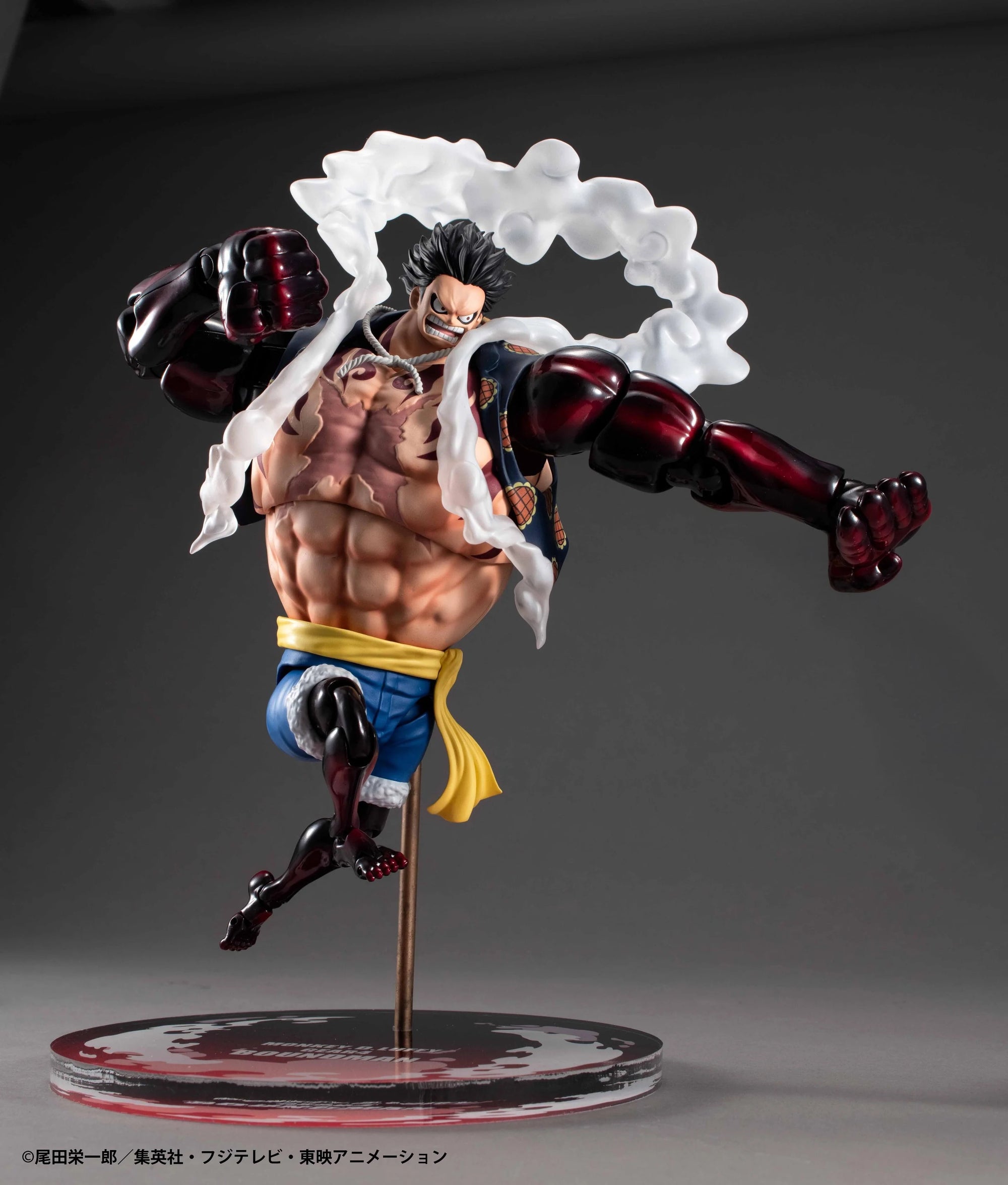 Luffy Gear 4 Boundman figure in a dynamic punching pose, with the white steam effect parts attached and a red and black base.