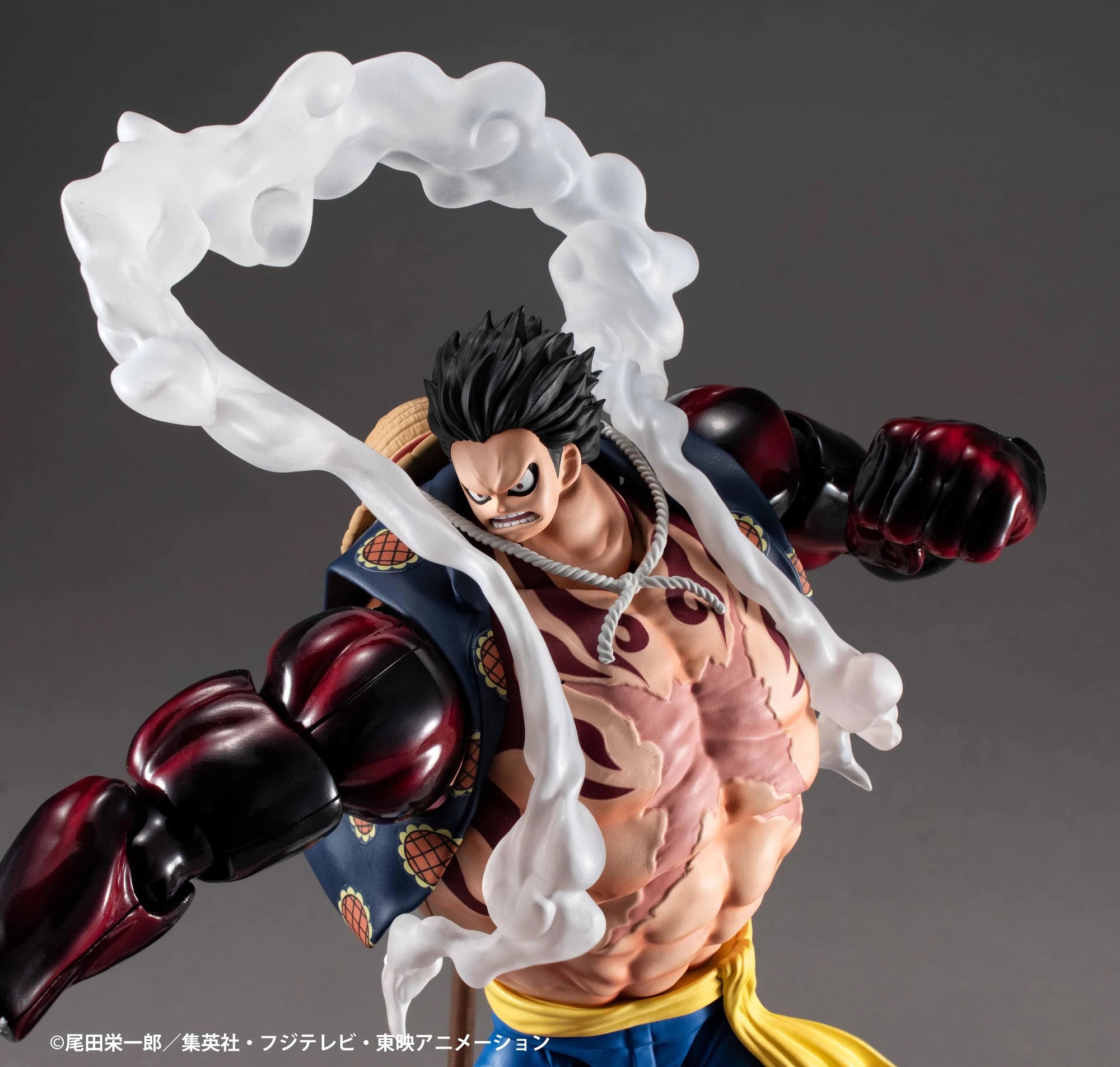 A close-up of the Luffy Gear 4 figure's upper body, highlighting the cracked skin texture, angry expression, and white steam effects.