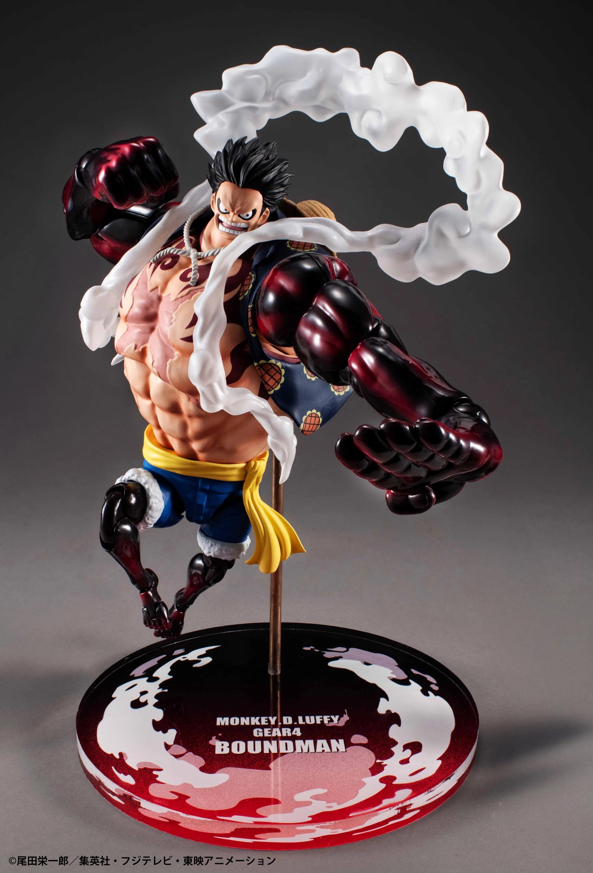 A side angle of the Luffy Gear 4 Boundman figure, posed mid-air with his massive fists clenched and the steam effects surrounding him.