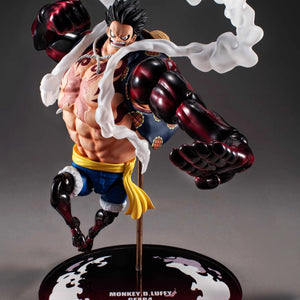 A side angle of the Luffy Gear 4 Boundman figure, posed mid-air with his massive fists clenched and the steam effects surrounding him.