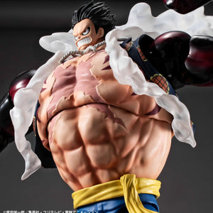 An extreme close-up of the Luffy Gear 4 Boundman figure's inflated torso, focusing on the highly detailed abdominal muscles and scar.