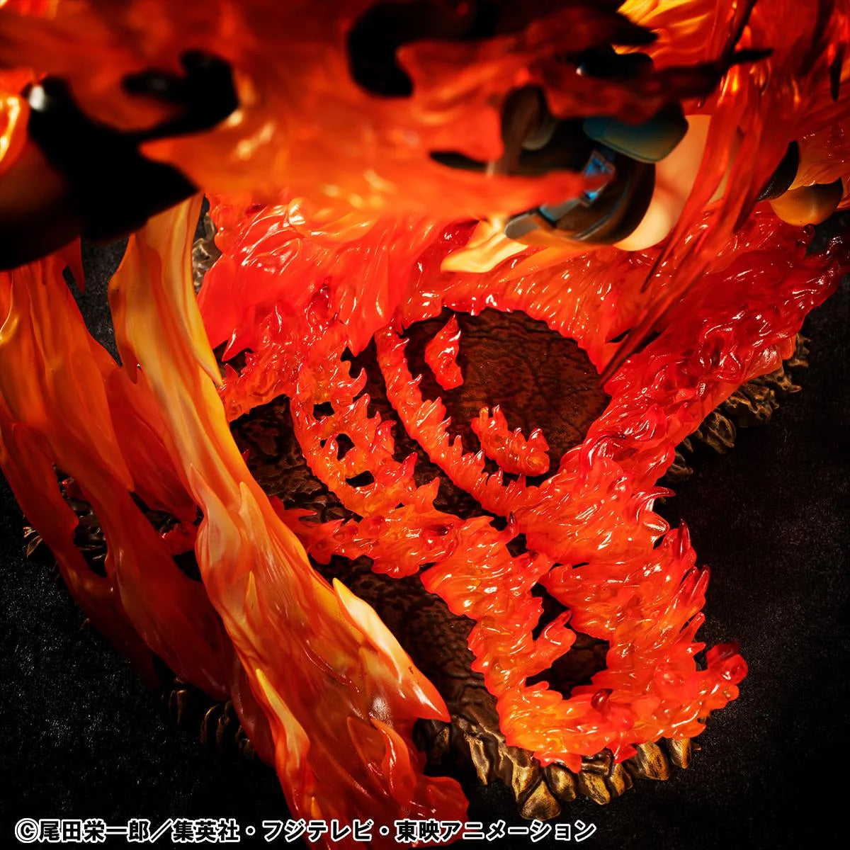 A close-up of the translucent red and orange flame base, revealing the Whitebeard Pirates symbol molded beneath the fire.