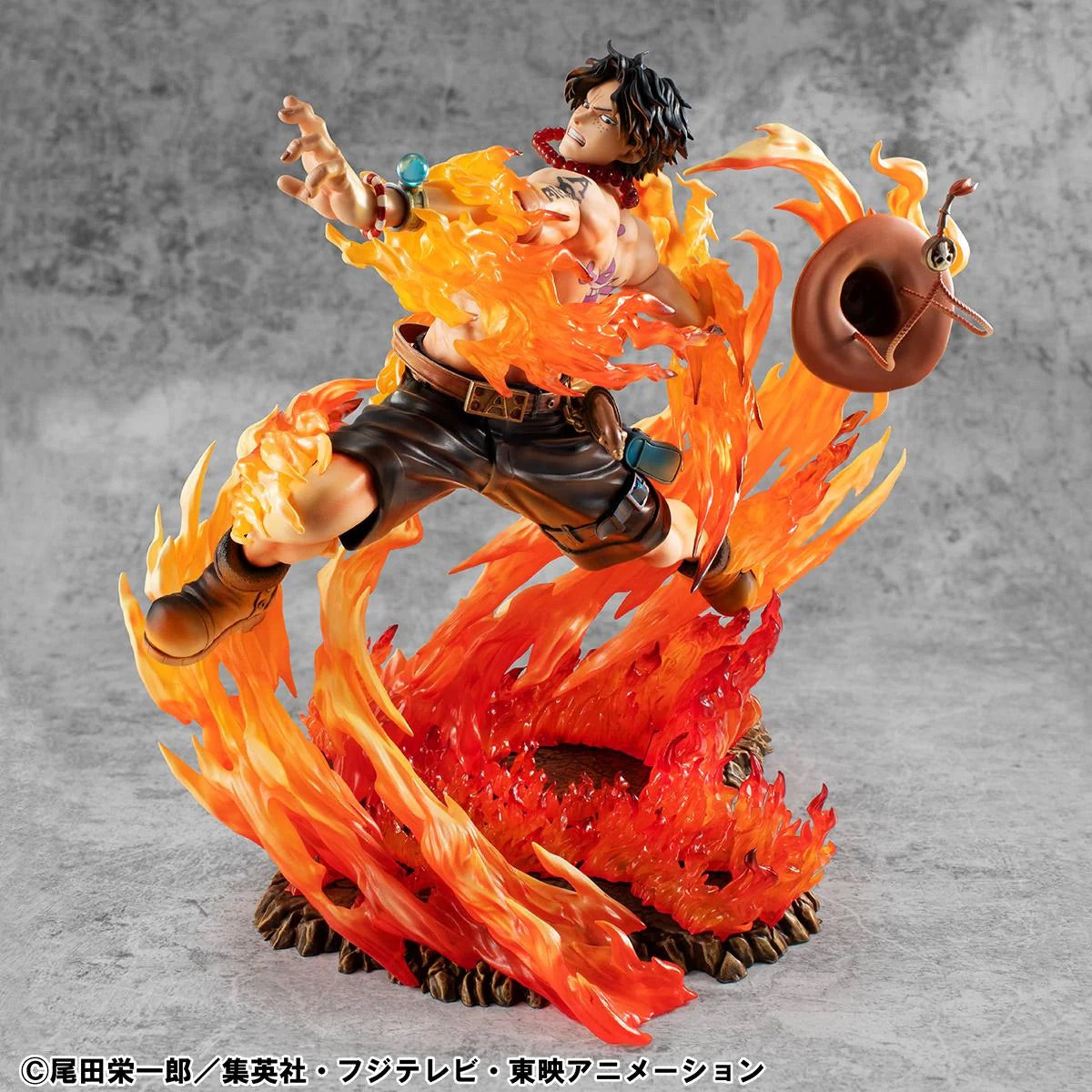 Ace figure mid-leap, with his signature hat captured flying off his head amidst the roaring flames.