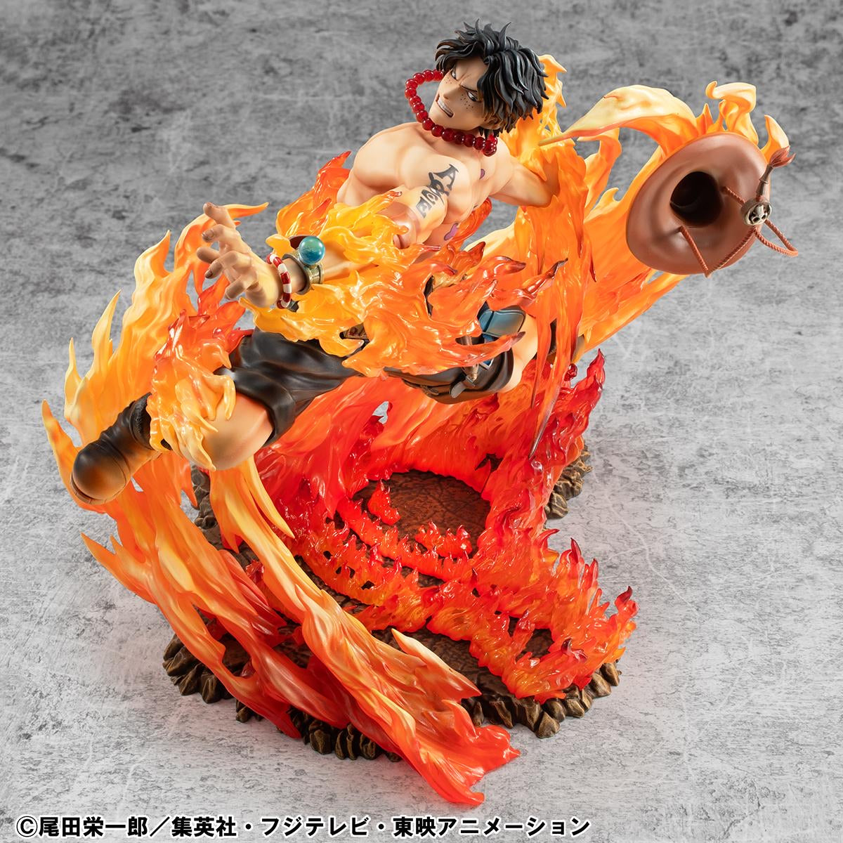 An overhead view of the Ace figure, emphasizing the intensity of his facial expression and the swirl of fire around him.