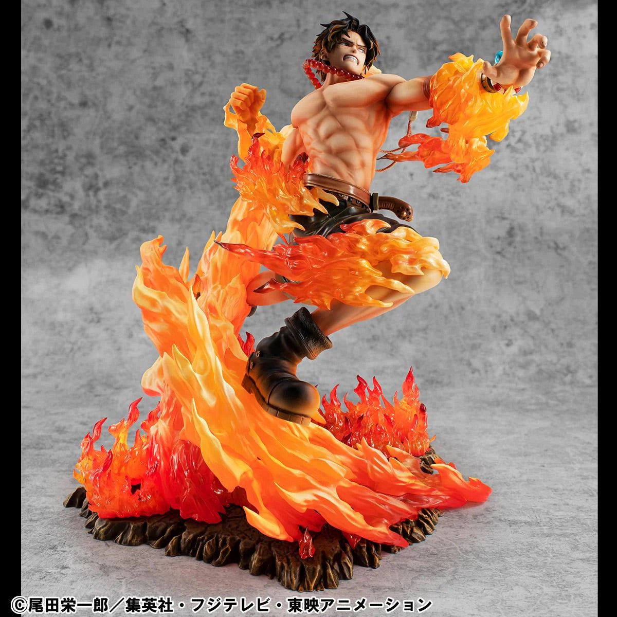 Ace figure posed with one arm outstretched, channeling fire and showing the detail of his red bead necklace.