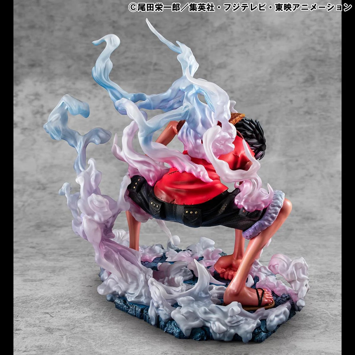 A slightly wider rear shot of the Luffy Gear 2 figure, emphasizing the wide stance and the base covered in steam effects.