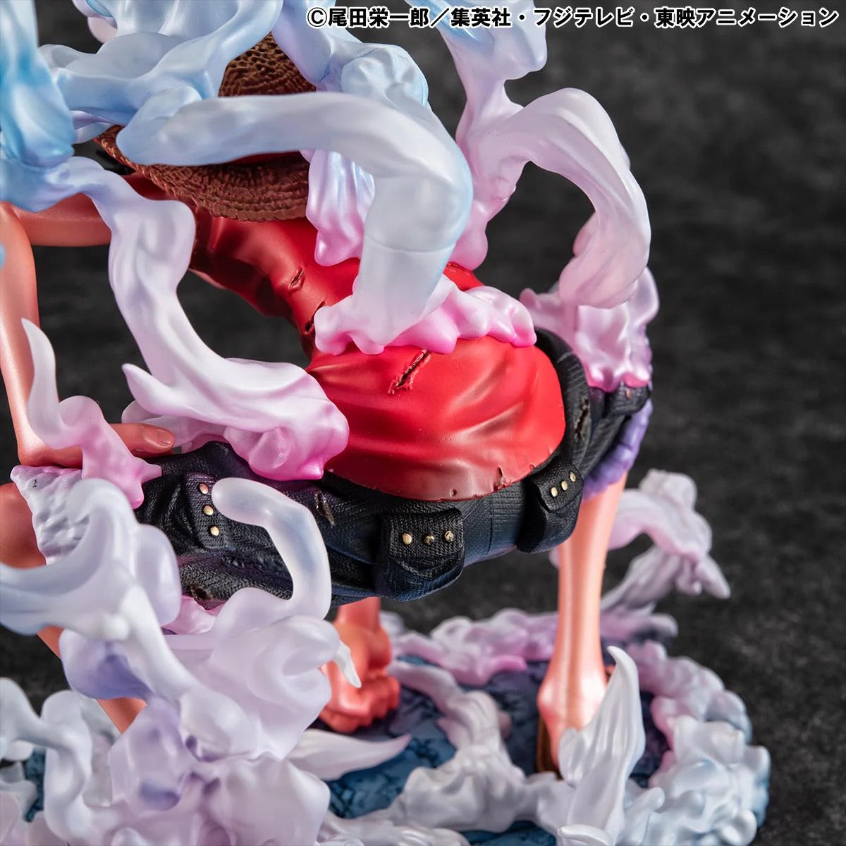 A close-up of the Luffy Gear 2 figure's lower back and shorts, showing the sculpting of his waistband and the pink steam effects.