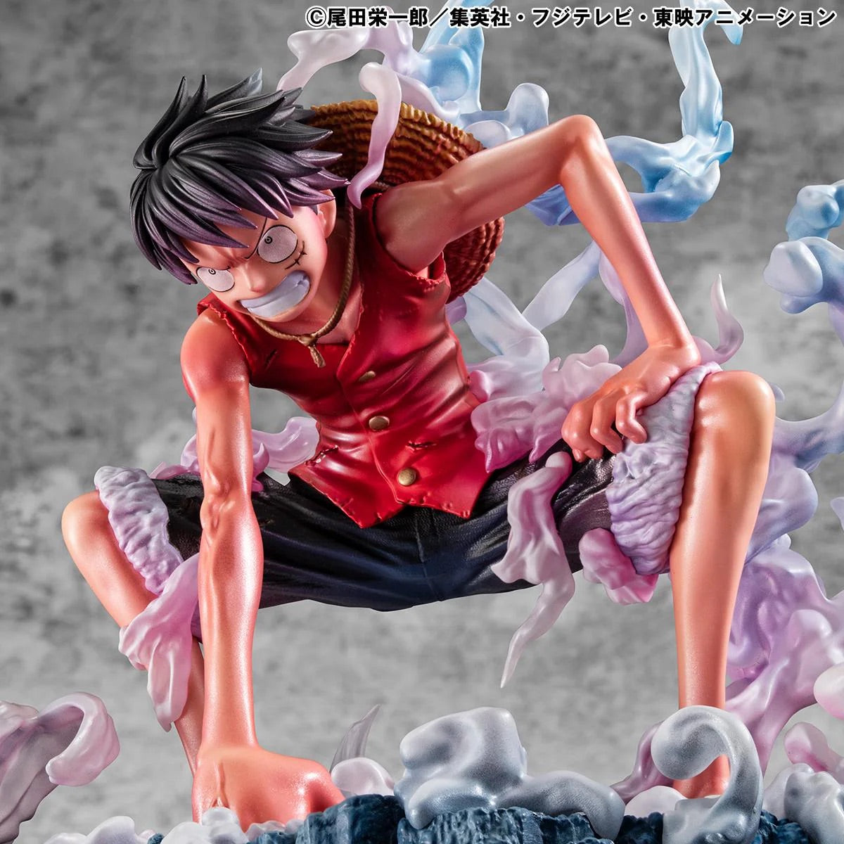 An extreme close-up of the Luffy Gear 2 figure's face while crouched, showcasing his gritted teeth and battle damage.
