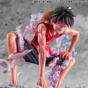 Luffy Gear 2 figure posed in the full crouch against a neutral gray background, emphasizing the figure's sculpt.