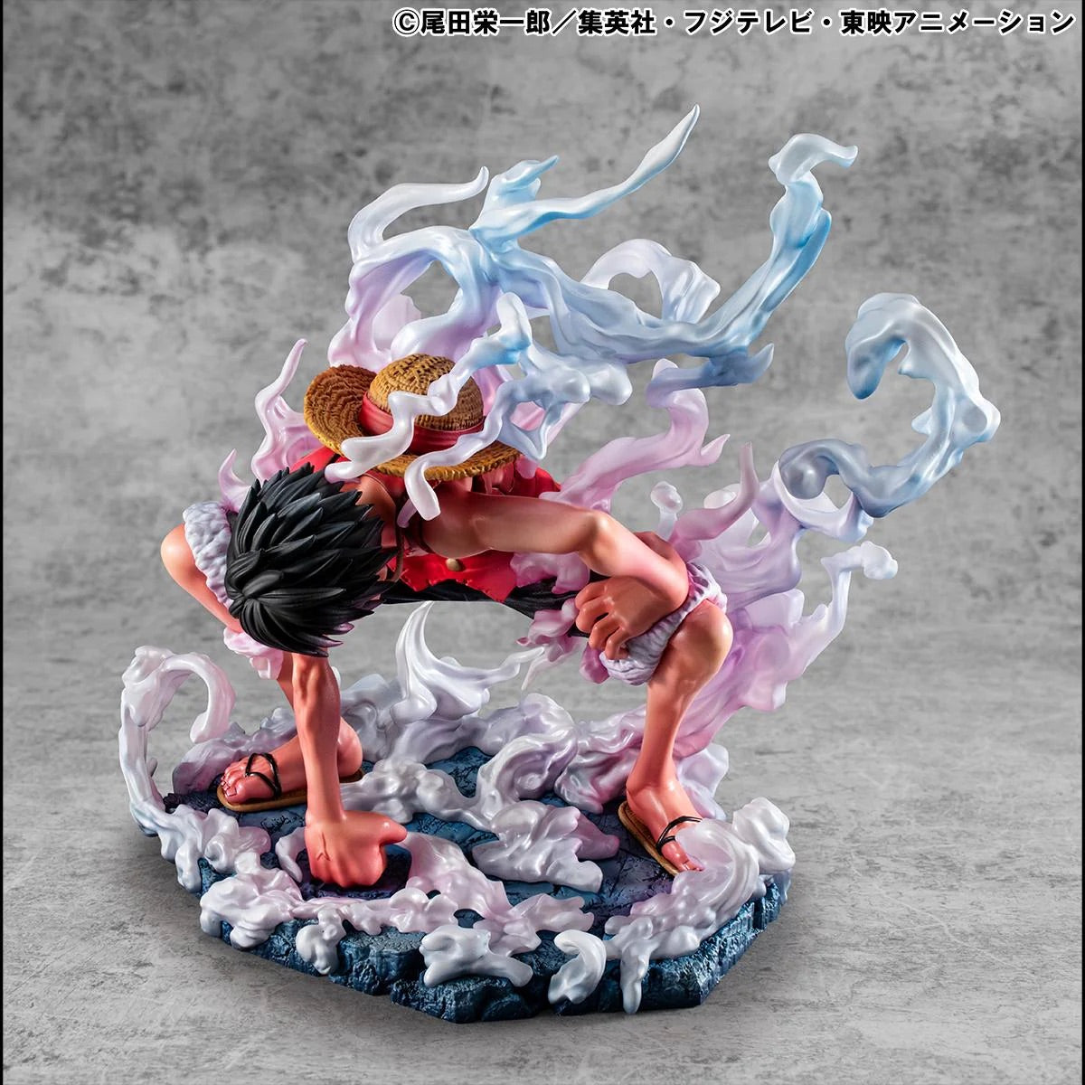 Front view of the Luffy Gear 2 figure, showing his face and hands clenched on the ground, ready to spring into action.