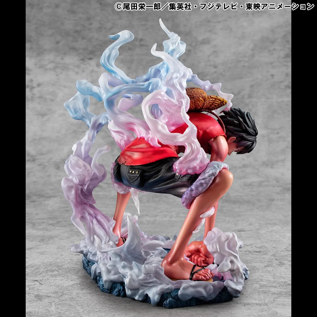 Side profile of the Luffy Gear 2 figure, showing his lean, charged body and the details of his red vest and sandals.