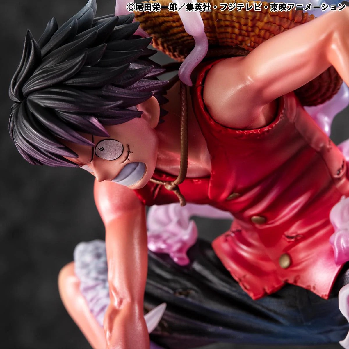 A close-up side view of the Luffy Gear 2 figure's face and torso, captured with dramatic, darker lighting.