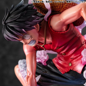 A close-up side view of the Luffy Gear 2 figure's face and torso, captured with dramatic, darker lighting.