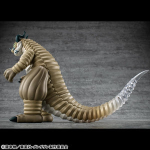 A detailed side-back view of the Transparent Kaiju figure, highlighting the long segmented tail and the gradient effect of the clear material.