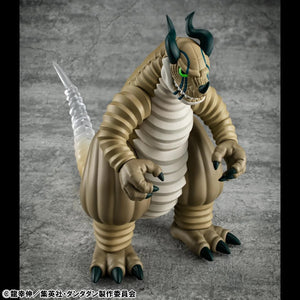 A lower-angle frontal shot of the Transparent Kaiju figure, emphasizing its large, squat body and the menacing expression on its face.