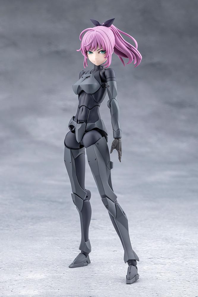 Full-length front view of the Emulator model kit in dark grey riding suit armor with pink ponytail hair.