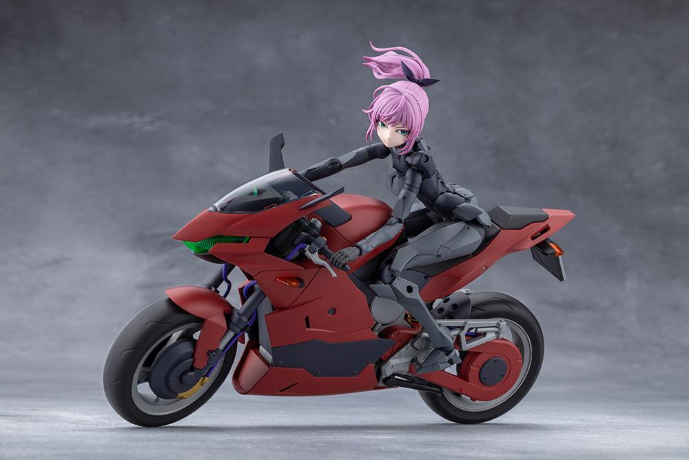Kotobukiya Megalomaria Emulator model kit posed leaning forward and riding the red sports motorcycle.