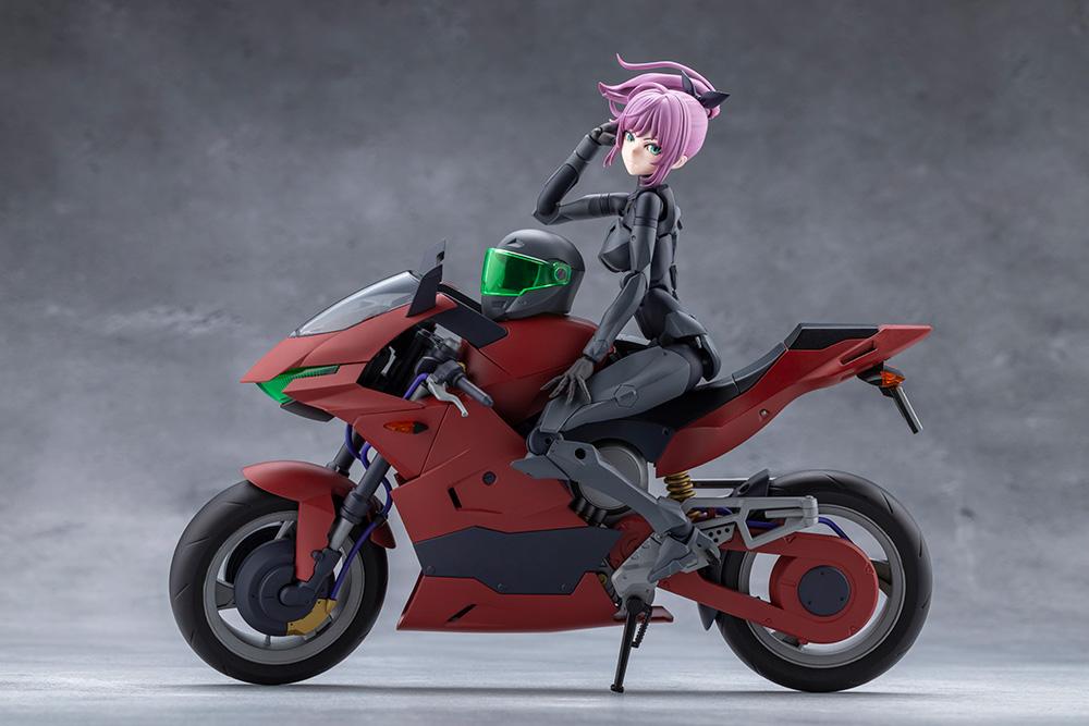 Megalomaria Unlimited Universe Emulator figure sitting sideways on the red Extreme Sports Bike with helmet on the tank.