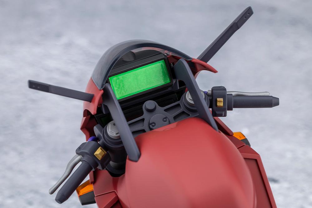 Top-down cockpit view of the bike model kit highlighting the green digital gauge display and controls.