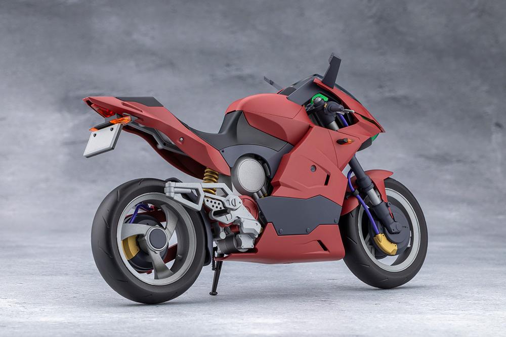 Rear angle view of the assembled red Extreme Sports Bike showing exhaust, wheels, and rear suspension details.