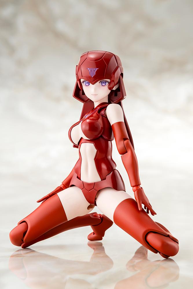 Kneeling pose of the Megami Device B1R-L Chassis Kit base model displaying high joint articulation on a mottled studio background.