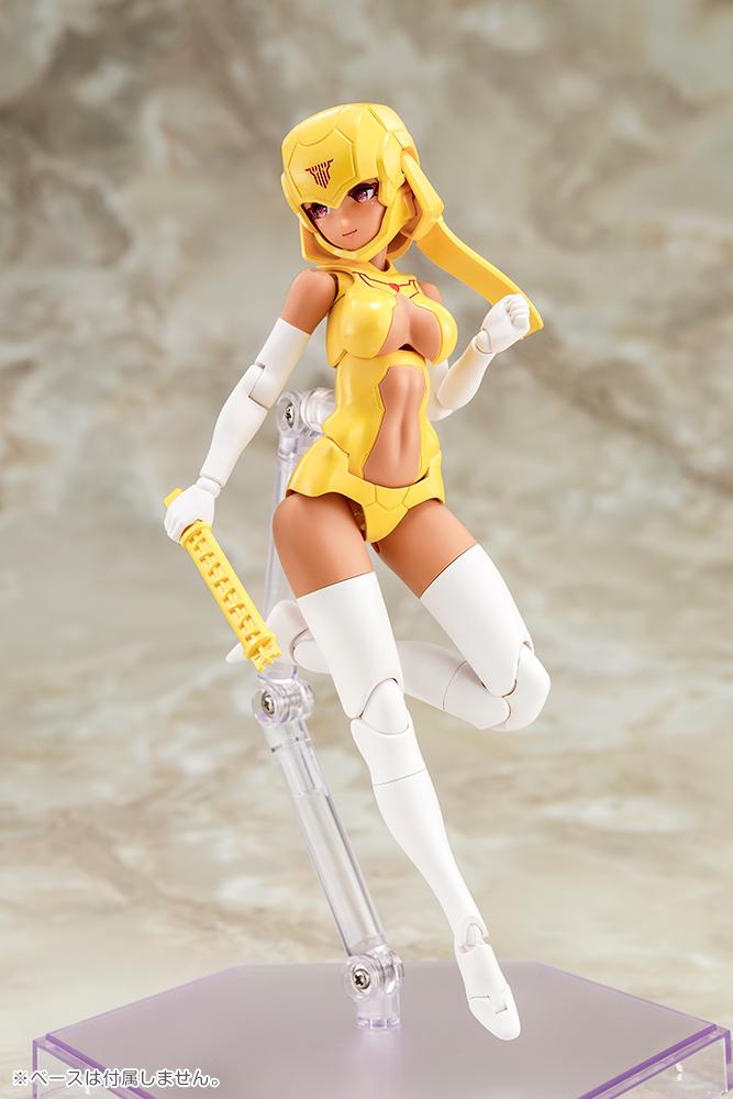 Megami Device B1R-L Chassis Kit model kit mounted on a clear stand while holding an eye adjustment tool accessory.