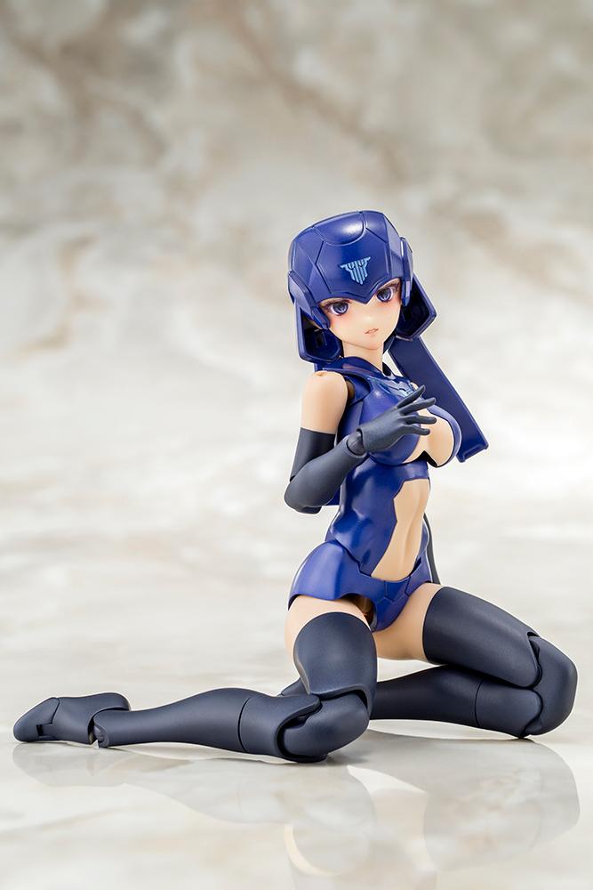Kneeling pose of the Megami Device B1R-L Chassis Kit base model displaying high joint articulation on a mottled studio background.