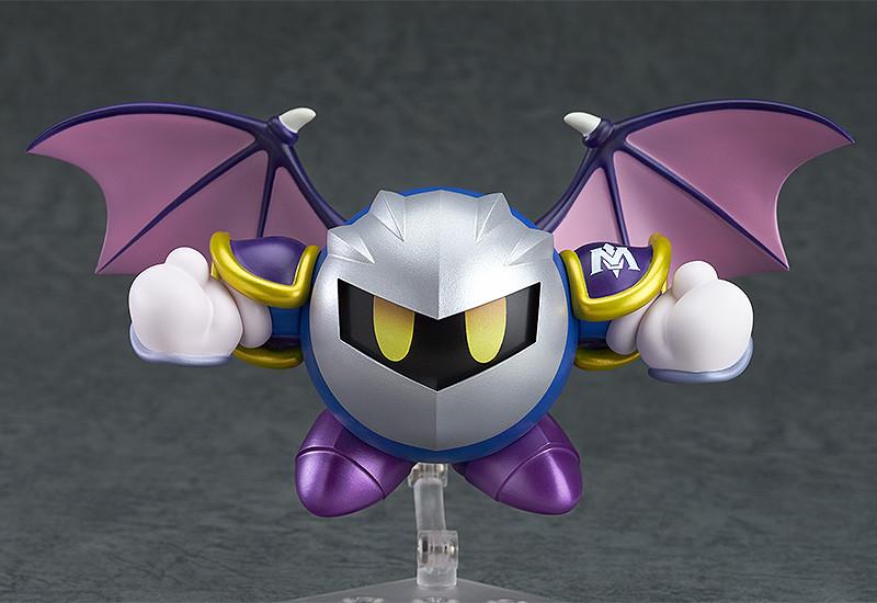 Symmetric front view of the Meta Knight Nendoroid in flight, highlighting the detailed mask, glowing yellow eyes, and expanded wingspan.