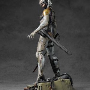 Side profile of Raiden 1/6 scale statue highlighting the cyborg exoskeleton and tactical knife sheath.