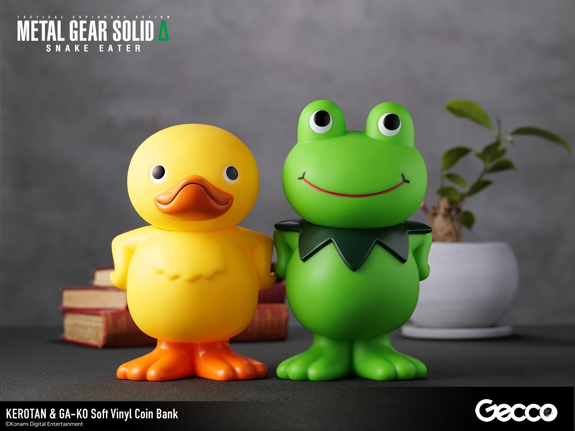 GA-KO yellow duck and Kerotan green frog soft vinyl coin banks displayed together on a decorated desk surface.