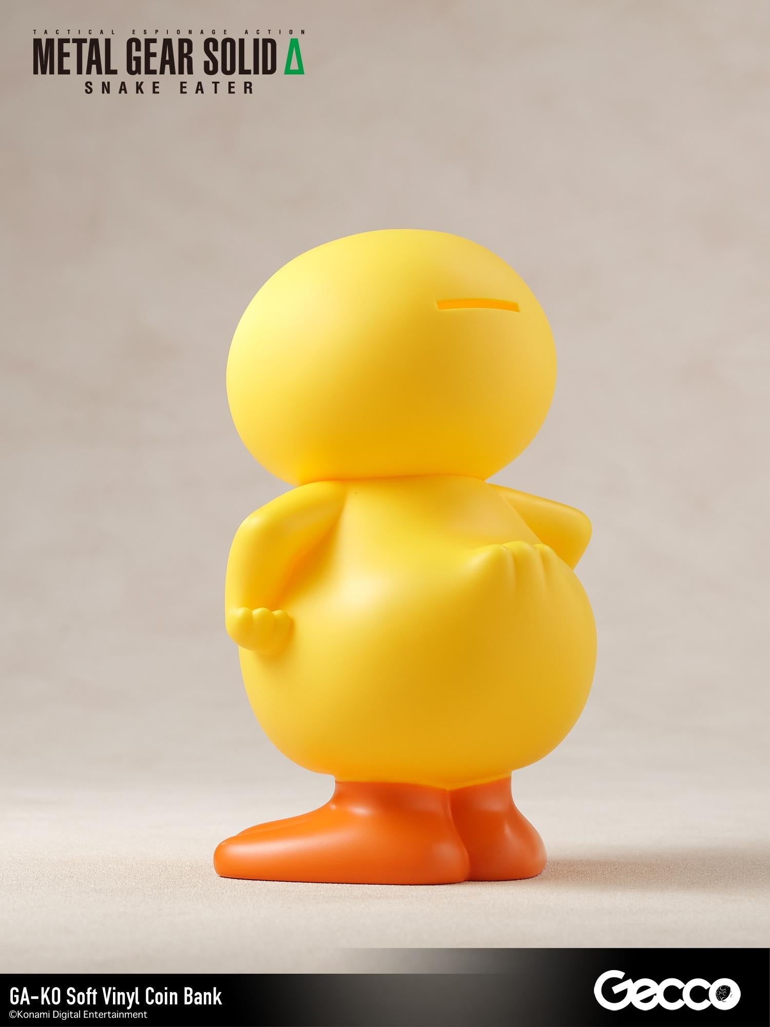 Rear three-quarter view showing the coin slot on the head of the GA-KO soft vinyl duck coin bank.