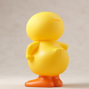 Rear three-quarter view showing the coin slot on the head of the GA-KO soft vinyl duck coin bank.