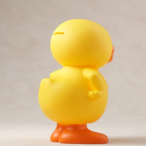 Rear right-side perspective of the GA-KO vinyl coin bank figure.