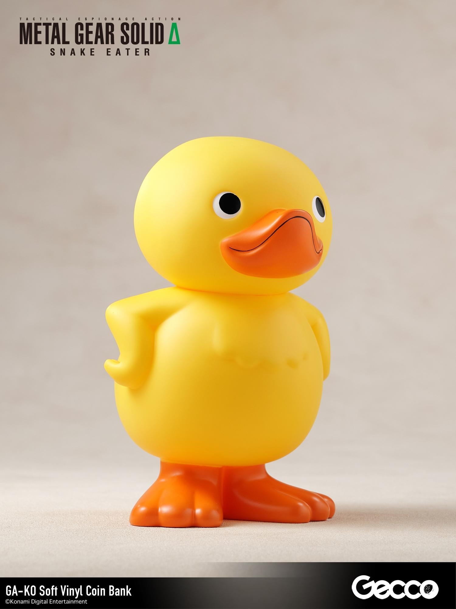 Front right three-quarter angle of the GA-KO soft vinyl coin bank figure.