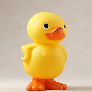 Front right three-quarter angle of the GA-KO soft vinyl coin bank figure.